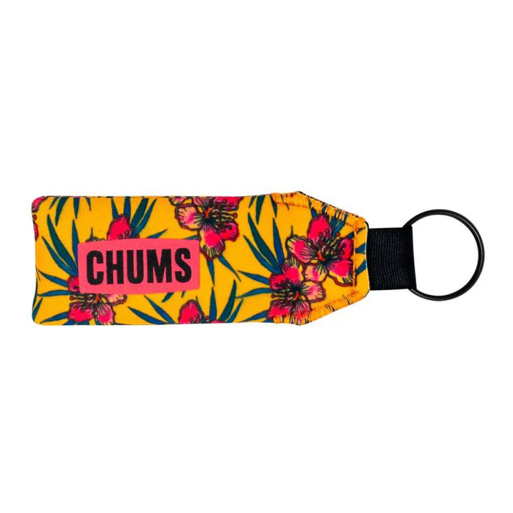 Floral-patterned keychain with 'CHUMS' branding on a yellow background
