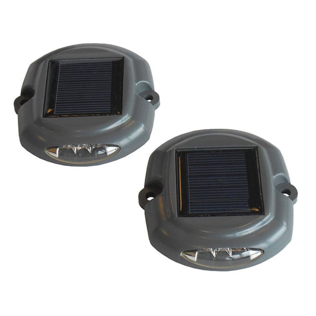 Two solar-powered outdoor lights on a white background