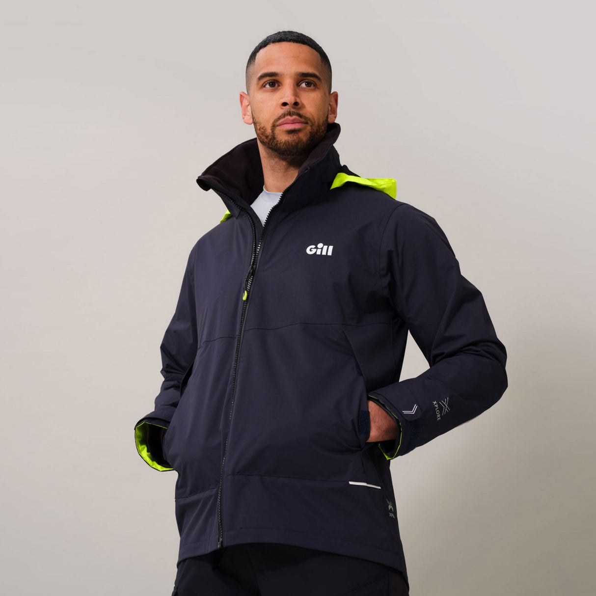 Man wearing Gill Coastal Jacket.