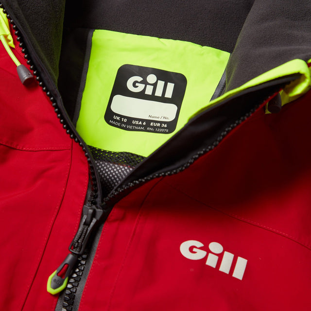 Close-up of a red Gill jacket with a focus on the brand logo and material details.