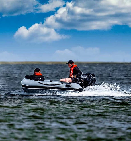 Two people in dinghy.