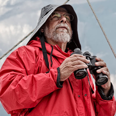 Sailor holding binoculars