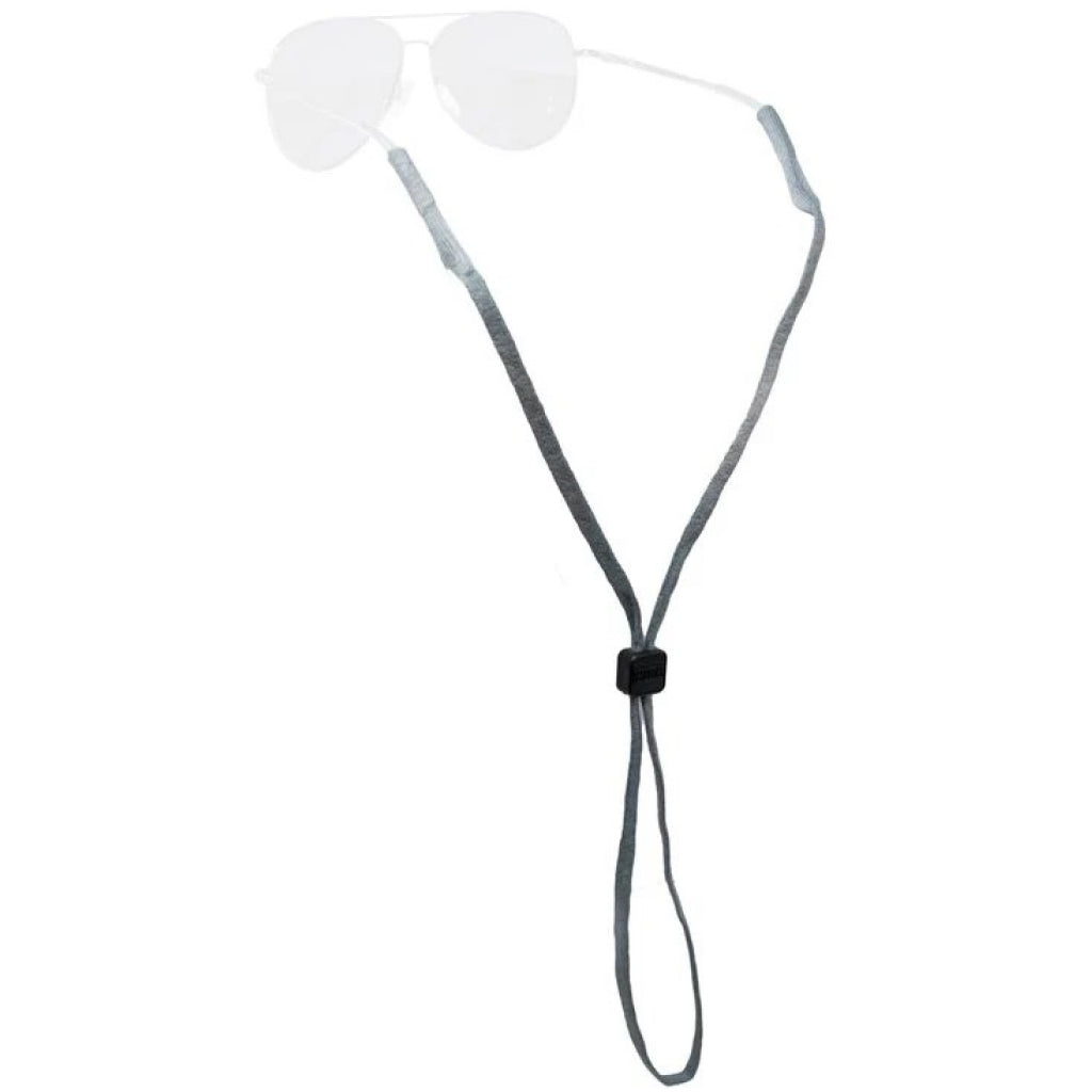 A gray adjustable fabric sunglasses strap with a black plastic toggle, shown hanging against a plain white background. Faintly at the top, the clear lenses and white arms of aviator-style sunglasses are visible behind the strap.