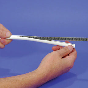 Person holding 3/16" Stay Cable Cover