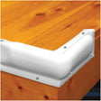 Wooden surface with a white corner guard