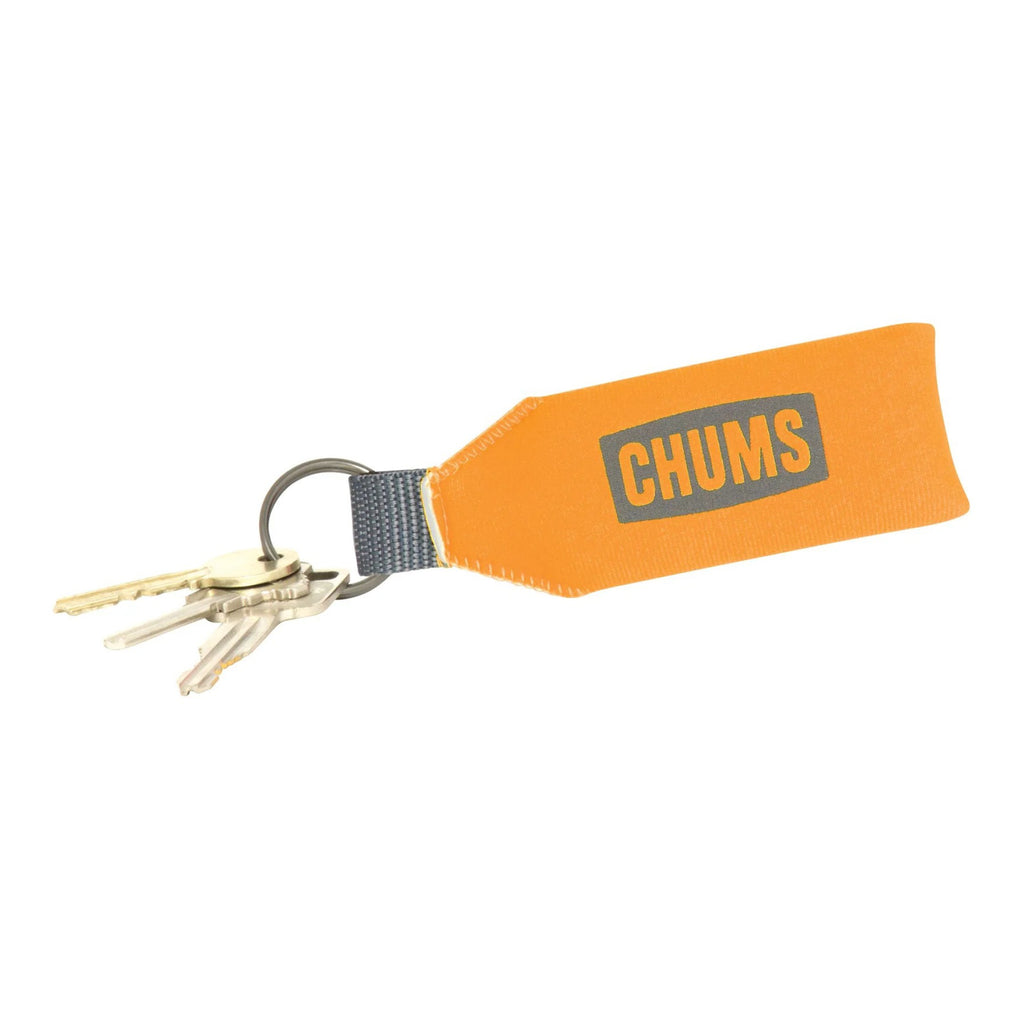 Orange keychain with 'CHUMS' logo on a white background