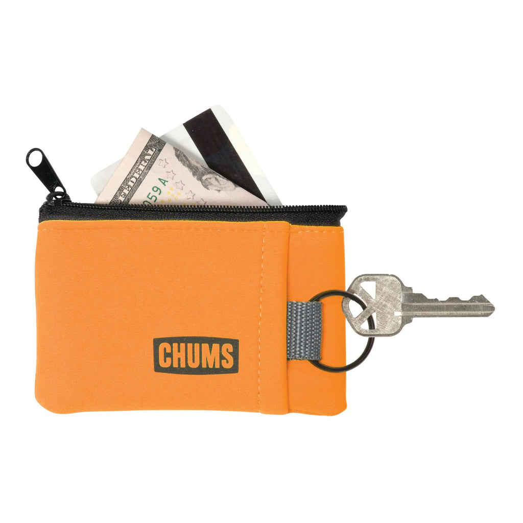 Orange zippered pouch with money, card, and key on a white background