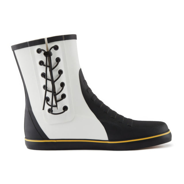 Black and white rain boot with yellow trim on a white background