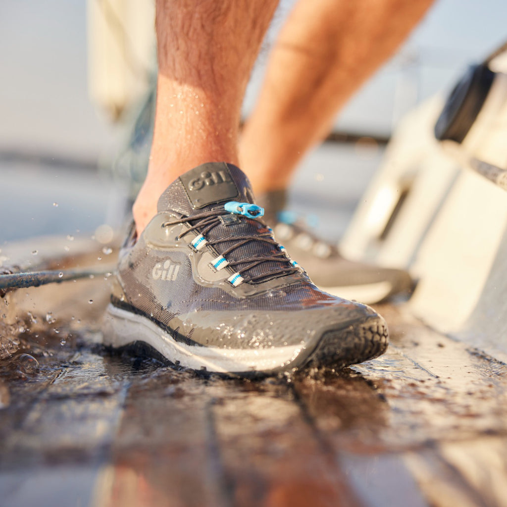 Person wearing Gill Verso Race Trainer Shoe.