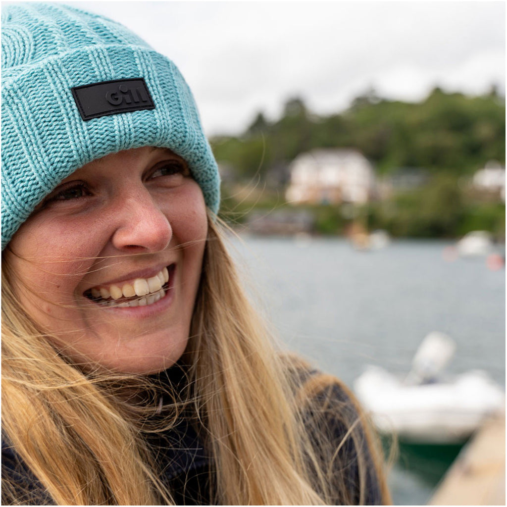 Woman wearing Gill Reversible Knit Beanie Hat.
