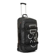 A black rolling duffel bag with an extended silver telescoping handle, featuring a large white vertical 'GOLI' logo on the front, black compression straps, and a top carry handle, set against a plain white background.