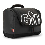 A black Gili travel pouch with a large white Gili logo on the front flap, featuring a top carry handle and zippered compartments, shown on a white background.