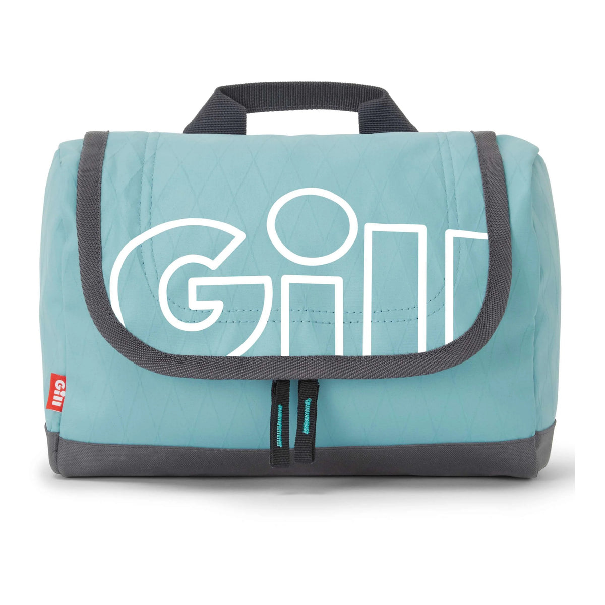 A light blue quilted travel pouch by GILL, featuring a large white outlined logo on the front, dark gray trim, a top handle, and zippered compartments, shown on a white background.