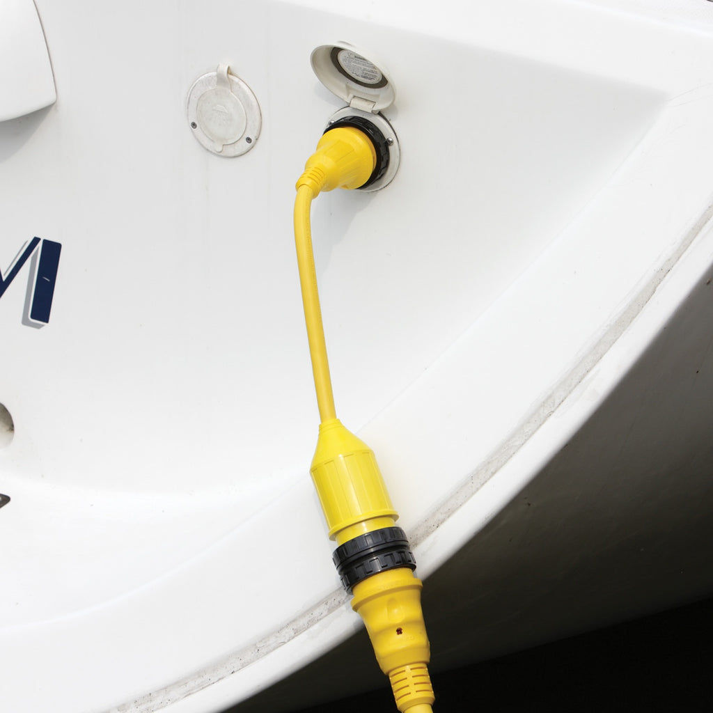 Marinco 30A Fem/15A Male EEL Adapter Pigtail plugged into boat.