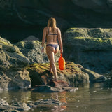 Person using Kifflab Sidekick 5L Dry Pack.