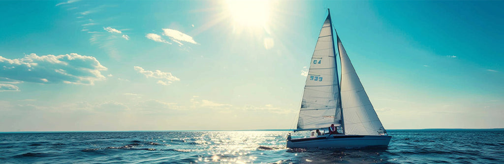 Sailing on lake in summer with a sunny sky.