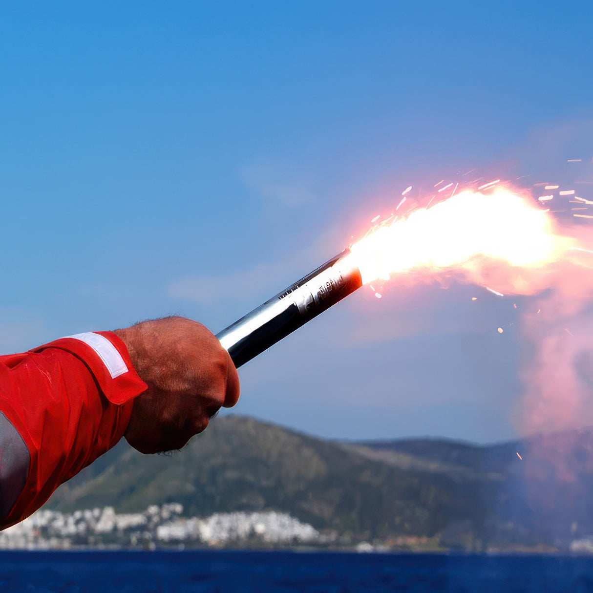 Person holding flare.