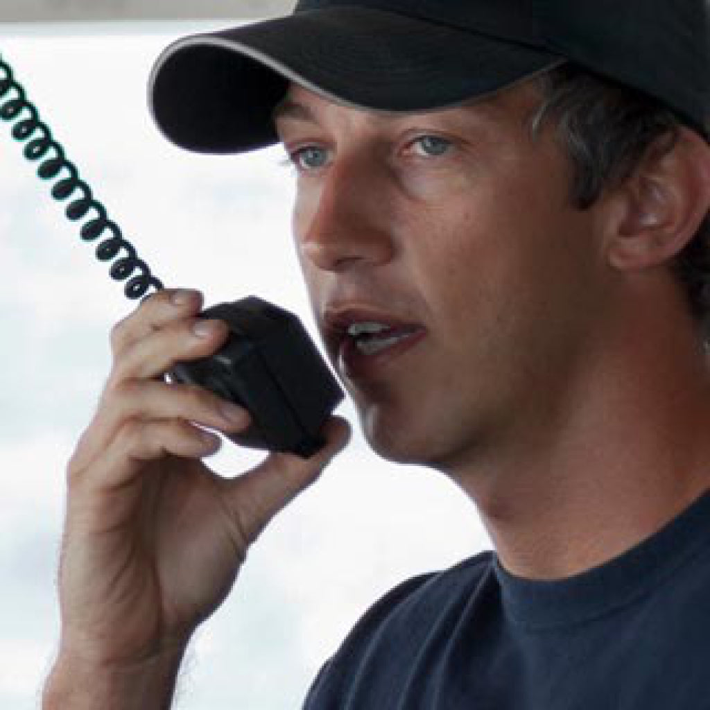 Person Speaking Into Raymarine Ray73 Vhf Radio With Gps, Ais Receiver.